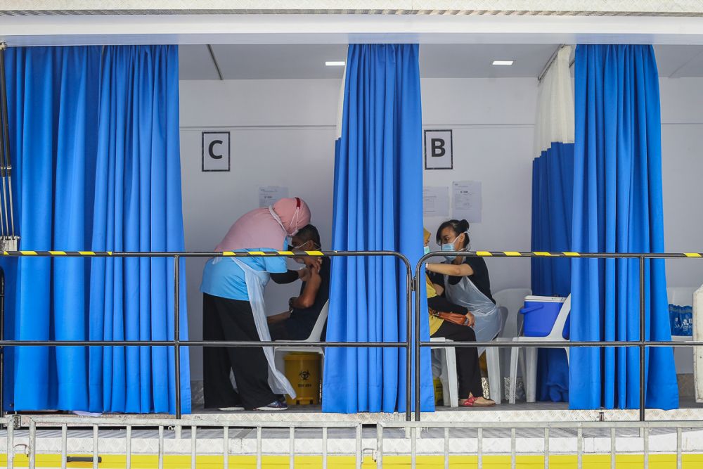 Members of the public receive their Covid-19 shot through the MYMedic@Wilayah Vaccine Mobile Truck programme at PPR Sg. Bonus in Setapak, Kuala Lumpur June 21, 2021. u00e2u20acu201d Picture by Yusof Mat Isa