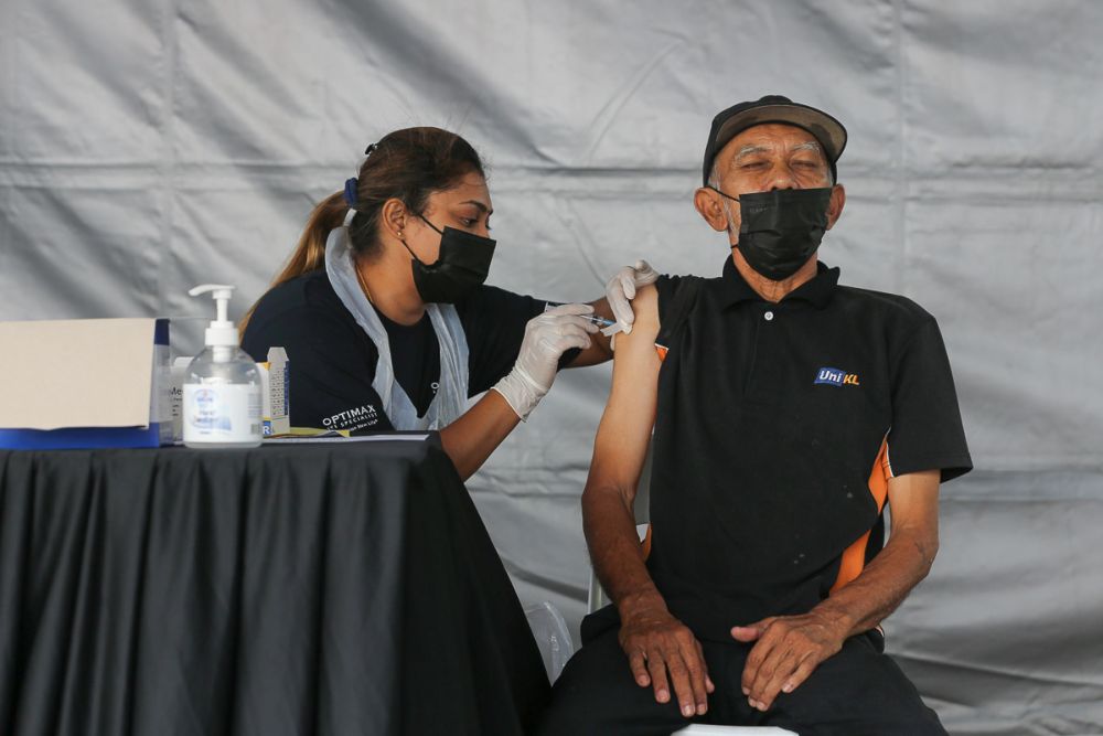 Members of the public receive their Covid-19 shot through the MYMedic@Wilayah Vaccine Mobile Truck programme at PPR Sg. Bonus in Setapak, Kuala Lumpur June 21, 2021. u00e2u20acu201d Picture by Yusof Mat Isa