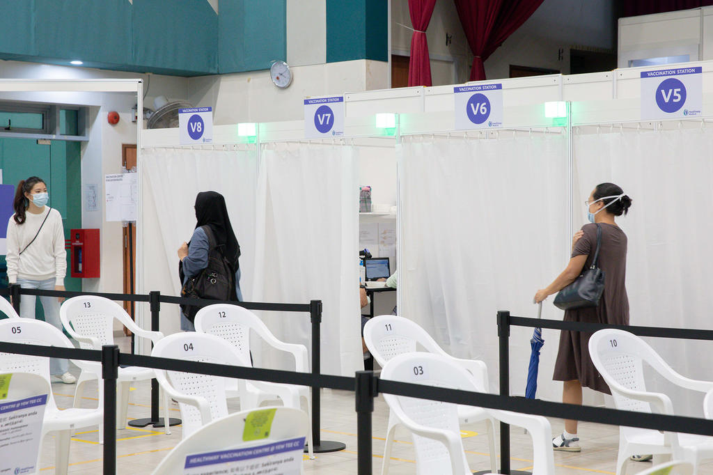 People walking to the observation station after getting their Covid-19 vaccine at Yew Tee Community Centre on April 21, 2021. u00e2u20acu201d TODAY pic