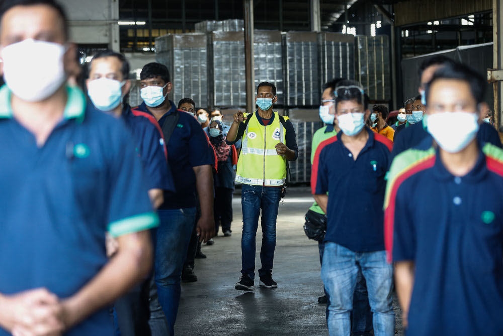 Enforcement officers conduct SOP spot checks on a factory in Mak Mandin, Penang, June 23, 2021. u00e2u20acu201d Picture by Sayuti Zainudin