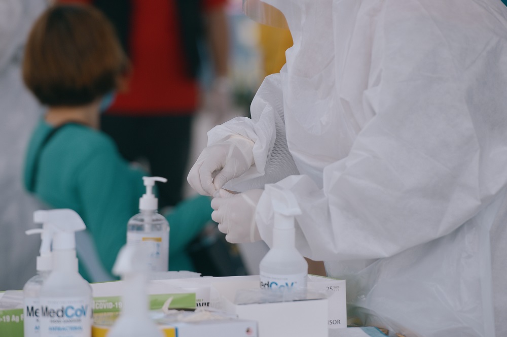 Healthcare workers collect swab samples to test for Covid-19 at the Selcare Clinic in Shah Alam June 24, 2021. u00e2u20acu201d Picture by Miera Zulyana