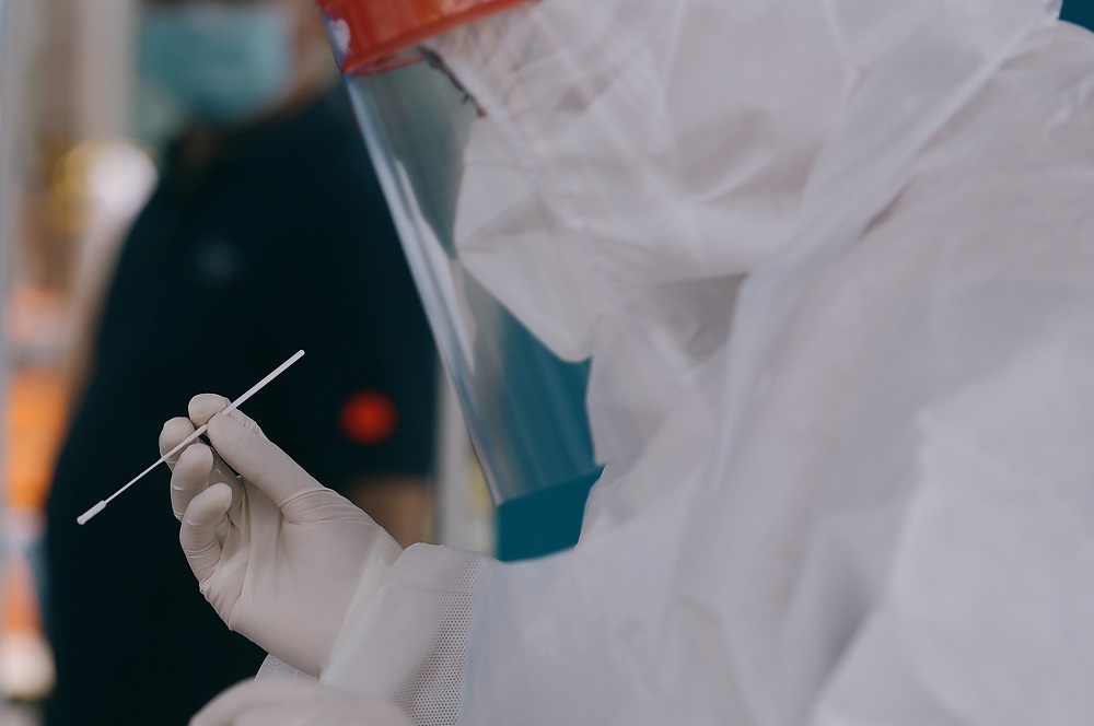 Healthcare workers collect swab samples to test for Covid-19 at the Selcare Clinic in Shah Alam June 24, 2021. u00e2u20acu201d Picture by Miera Zulyana