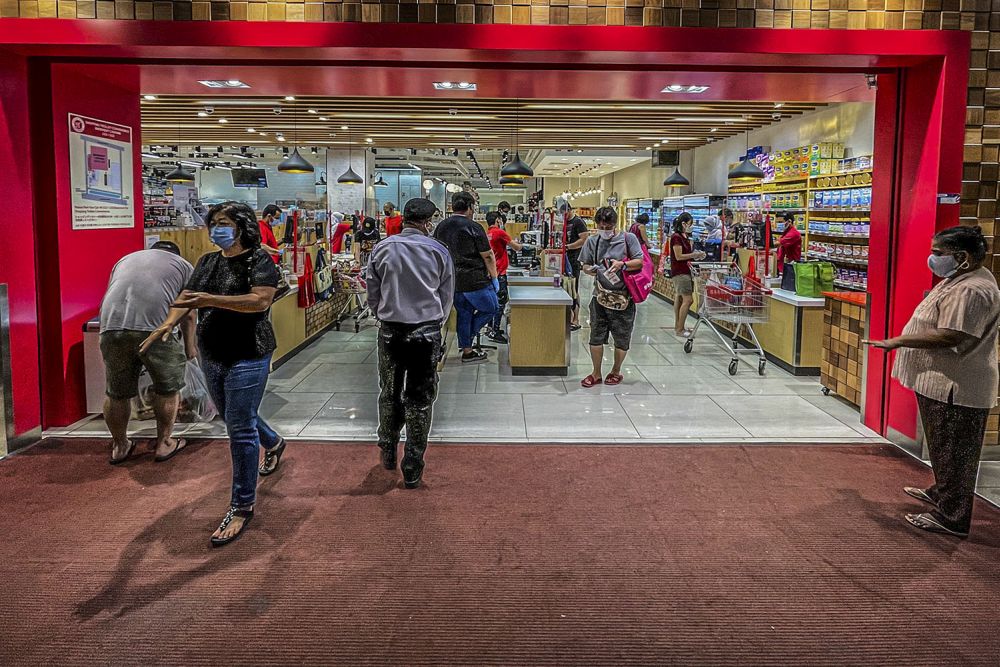 People shop for groceries at Jaya Grocer at 163 Retail Park June 7, 2021. u00e2u20acu201d Picture by Hari Anggara