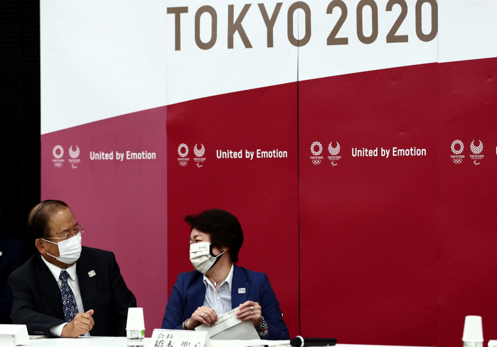 Tokyo 2020 President Seiko Hashimoto (right) and CEO Toshiro Muto chat before the start of the Tokyo 2020 Olympic Gamesu00e2u20acu2122 executive board meeting in Tokyo June 8, 2021. u00e2u20acu201d AFP pic 