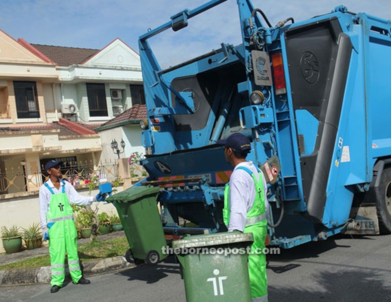 File photo shows Trienekens workers during a waste collection run. u00e2u20acu201d Borneo Post Online pic