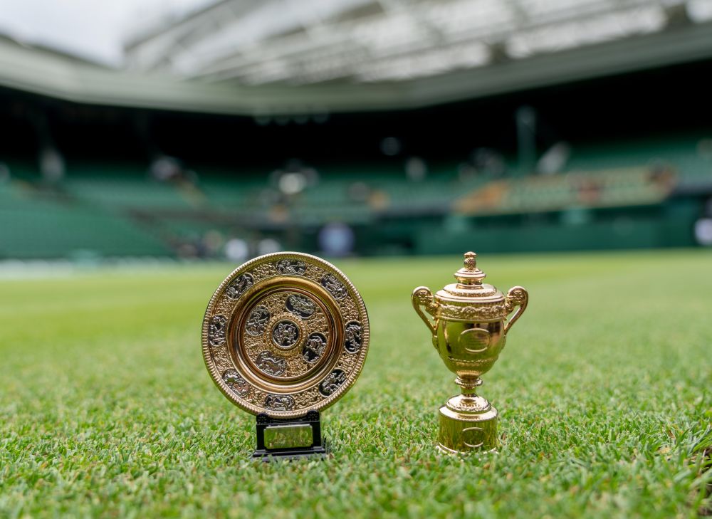 Miniature replicas of the Ladies and Gentlemen singles trophies are seen on the centre court at the All England Lawn Tennis and Croquet Club, London June 30, 2021. u00e2u20acu201d Reuters picn