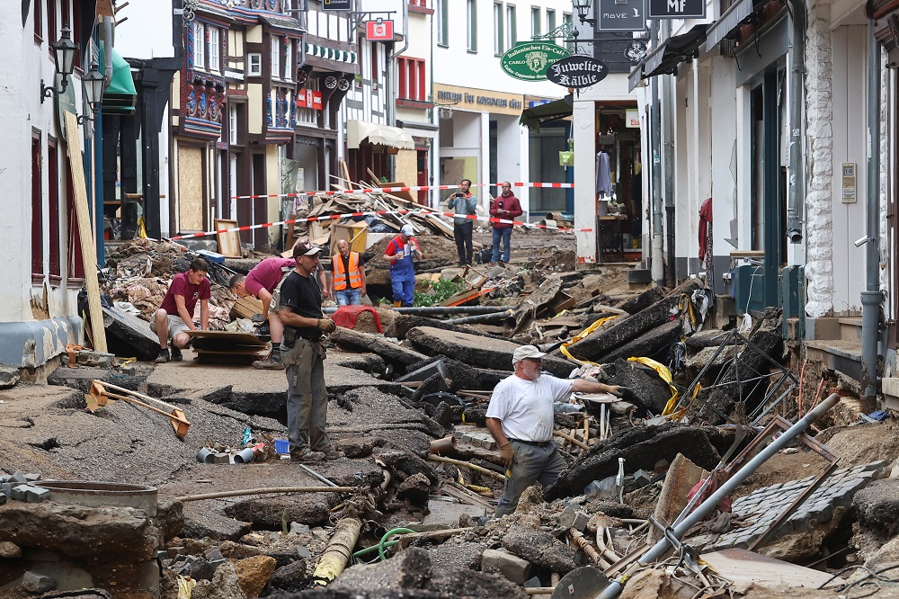 People are seen in an area affected by floods caused by heavy rainfalls in Bad Muenstereifel, Germany July 19, 2021. — Reuters pic
