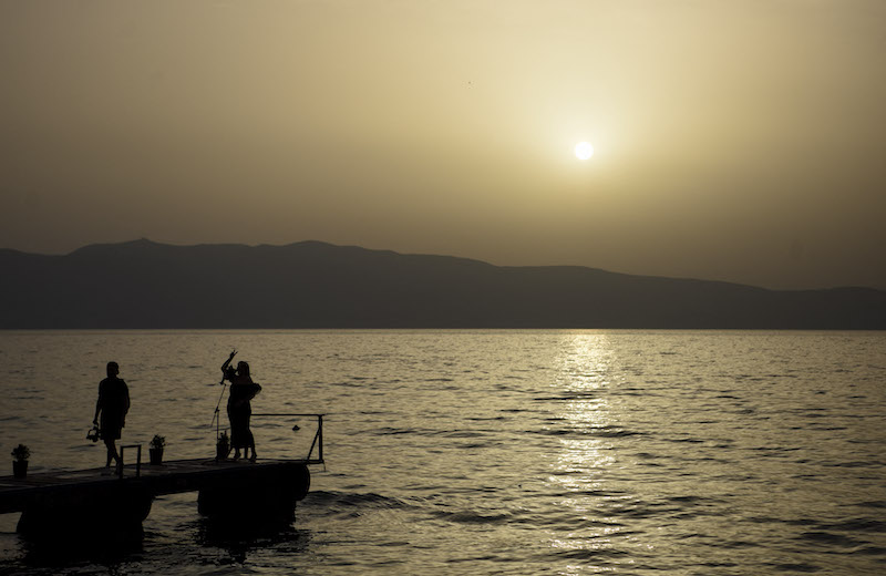 Local residents enjoy the sunset on Lake Ohrid in the village of Trpeica, near Ohrid, southwestern of the Republic of North Macedonia June 22, 2021. u00e2u20acu201d AFP pic