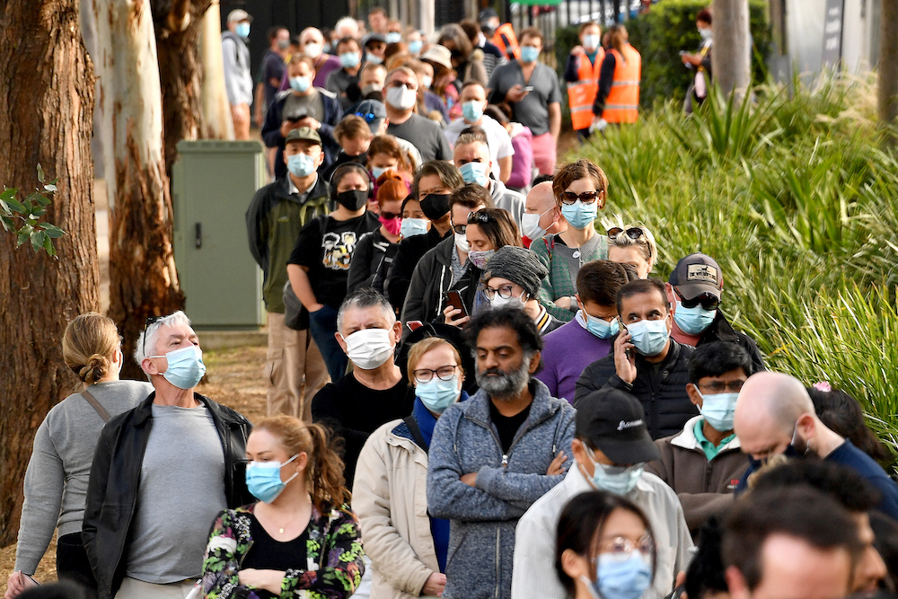 Sydneysiders queue outside a vaccination centre in Sydney on June 24, 2021, as residents were largely banned from leaving the city to stop a growing outbreak of the highly contagious Delta Covid-19 variant spreading to other regions. u00e2u20acu201d AFP pic