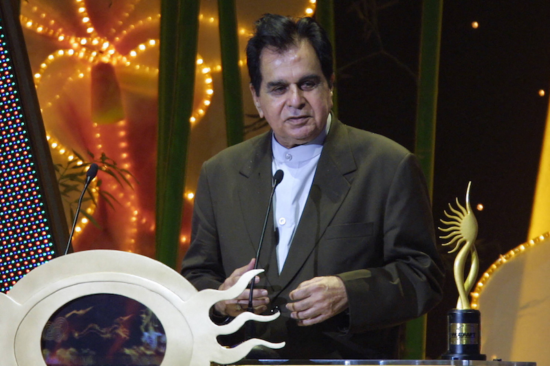 In this file photo taken on May 22, 2004, Indian veteran actor Dilip Kumar speaks at the podium for his award for outstanding achievement in Indian cinema at the 5th International Indian Film Academy (IIFA) Awards in Singapore. u00e2u20acu201d AFP pic
