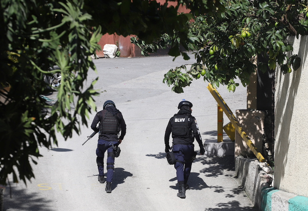Police officers walk near the private residence of Haiti's President Jovenel Moise after he was shot dead by gunmen with assault rifles, in Port-au-Prince, Haiti July 7, 2021. u00e2u20acu201d Reuters pic