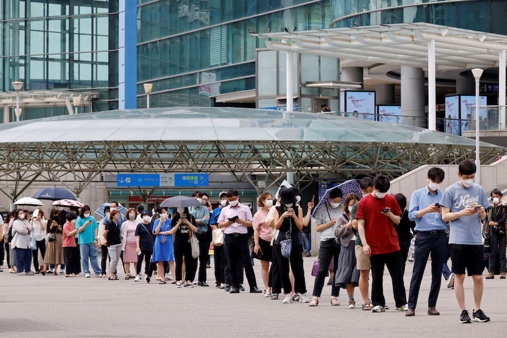 People wait in line for a Covid-19 test at a testing site, temporarily set up at a railway station in Seoul, South Korea July 7, 2021. u00e2u20acu201d Reuters pic