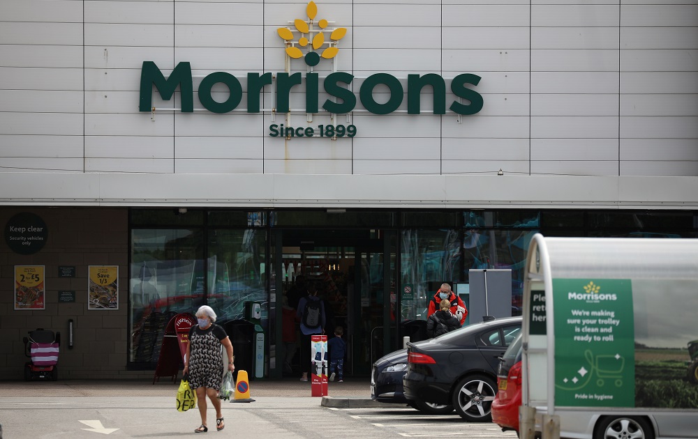 A customer carries a shopping bag outside a Morrisons supermarket in New Brighton, Britain July 5, 2021. u00e2u20acu201d Reuters pic