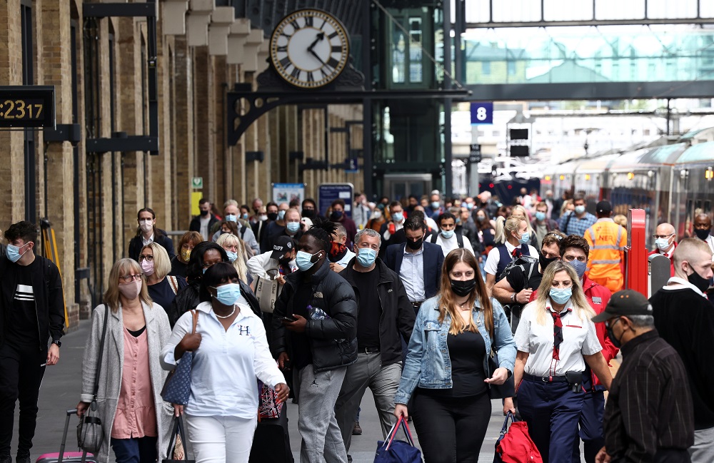 People wearing protective face masks walk along a platform at King's Cross Station, amid the coronavirus disease (COVID-19) outbreak in London July 12, 2021. u00e2u20acu201d Reuters pic