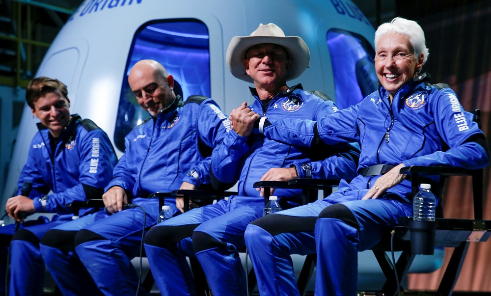 Businessman Jeff Bezos (third left) shakes hands with Wally Funk, during a post-launch press conference after they flew on Blue Originu00e2u20acu2122s inaugural flight to the edge of space, in the nearby town of Van Horn, Texas July 20, 2021. u00e2u20acu201d Reuters pic