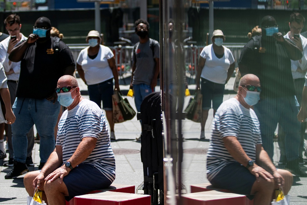 People wear masks to prevent against the spread of coronavirus disease as the highly transmissible Delta variant has led to a surge in infections, in New York July 30, 2021. u00e2u20acu201d Reuters pic
