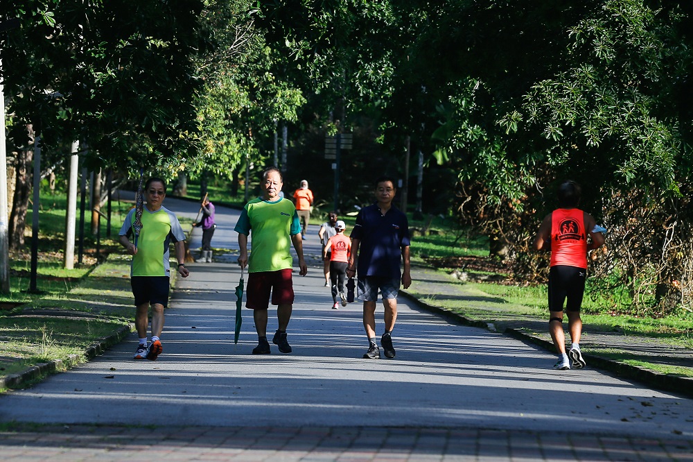 People exercising at the Penang Botanic Garden in George Town July 7, 2021. — Picture by Sayuti Zainudin