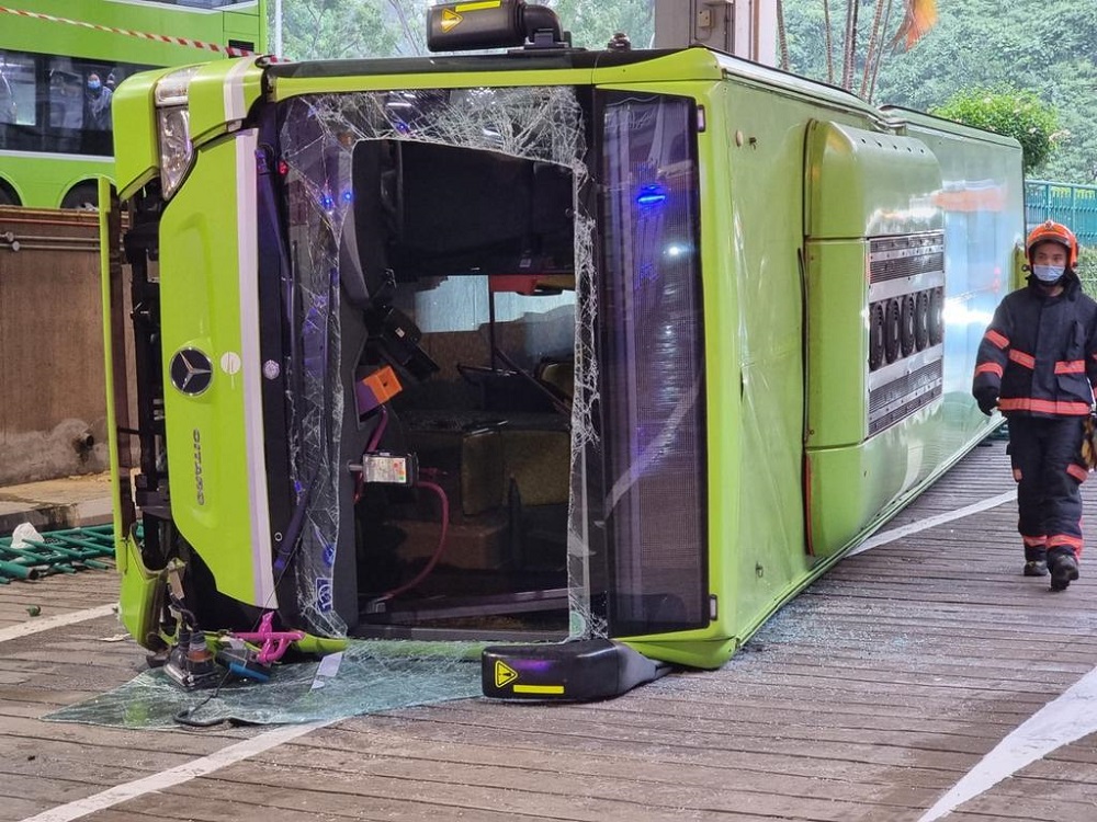 An eyewitness said one of the buses smashed past a green barricade and fell onto the road below, landing on its left side. u00e2u20acu201d Picture courtesy of SCDF via TODAY