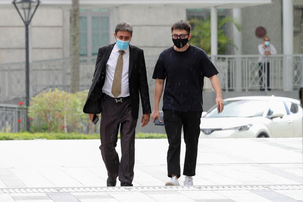 Ex-actor Shane Pow (right) arrives State Courts on April 22, 2021. u00e2u20acu201d TODAY pic
