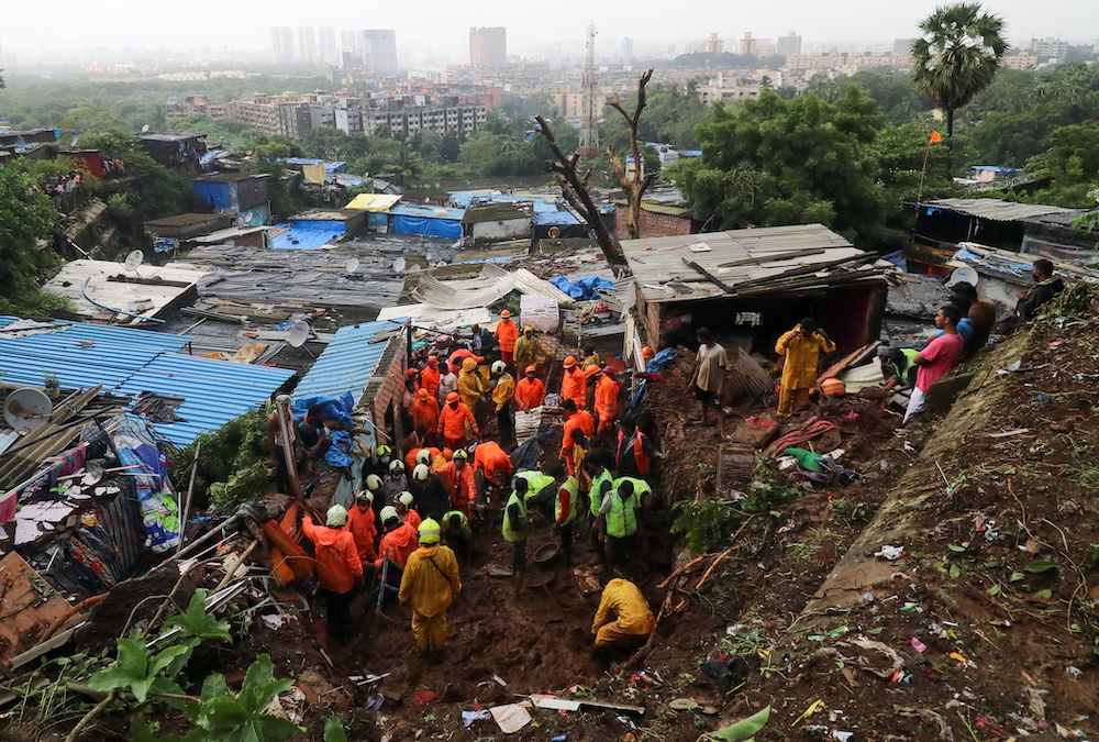 Rescue workers search for survivors after a residential house collapsed due to landslide caused by heavy rainfall in Mumbai, India, July 18, 2021. u00e2u20acu201d Reuters pic