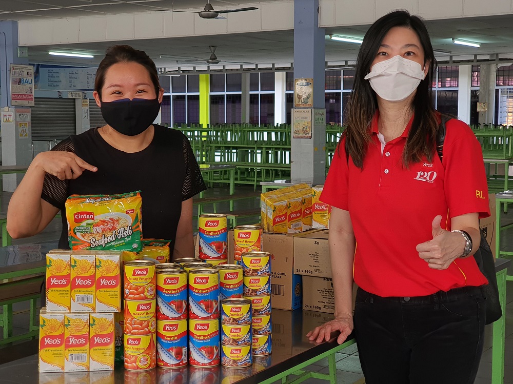 Refuge for the Refugees founder and director Heidy Quah (left) and Yeou00e2u20acu2122s marketing director Renda Low posing with some of the food items for the B40 families. u00e2u20acu201d Picture courtesy of Yeou00e2u20acu2122s