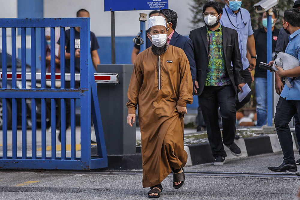 Preacher Ustaz Ebit Lew walks out of Dang Wangi IPD after making a police report July 21, 2020. u00e2u20acu201d Picture by Hari Anggara.
