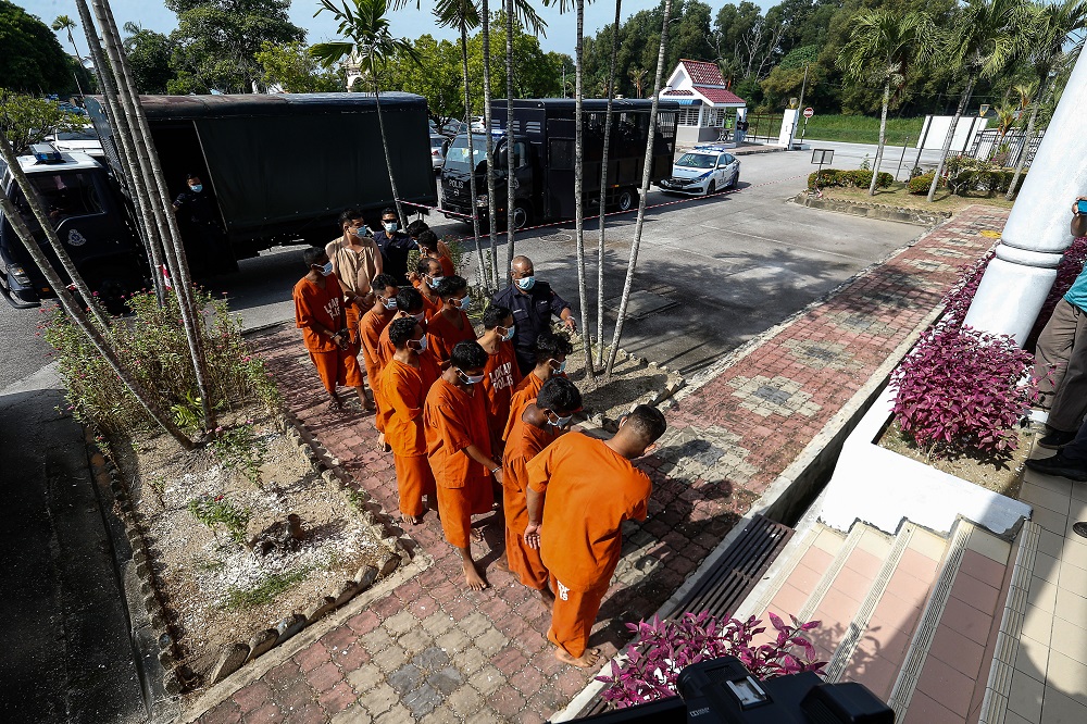 A group of men are led to the Bukit Mertajam Court to be remanded after a video clip of them performing Aidiladha prayers outside the Taman Pelangi Surau in Juru went viral on social media, July 21, 2021. u00e2u20acu201d Picture by Sayuti Zainudin