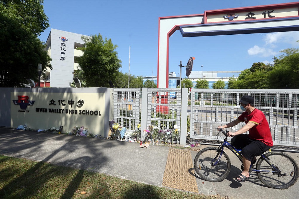 Bouquets of flowers seen left at the main gate of River Valley High School in Singapore on July 25, 2021. u00e2u20acu201d TODAY pic