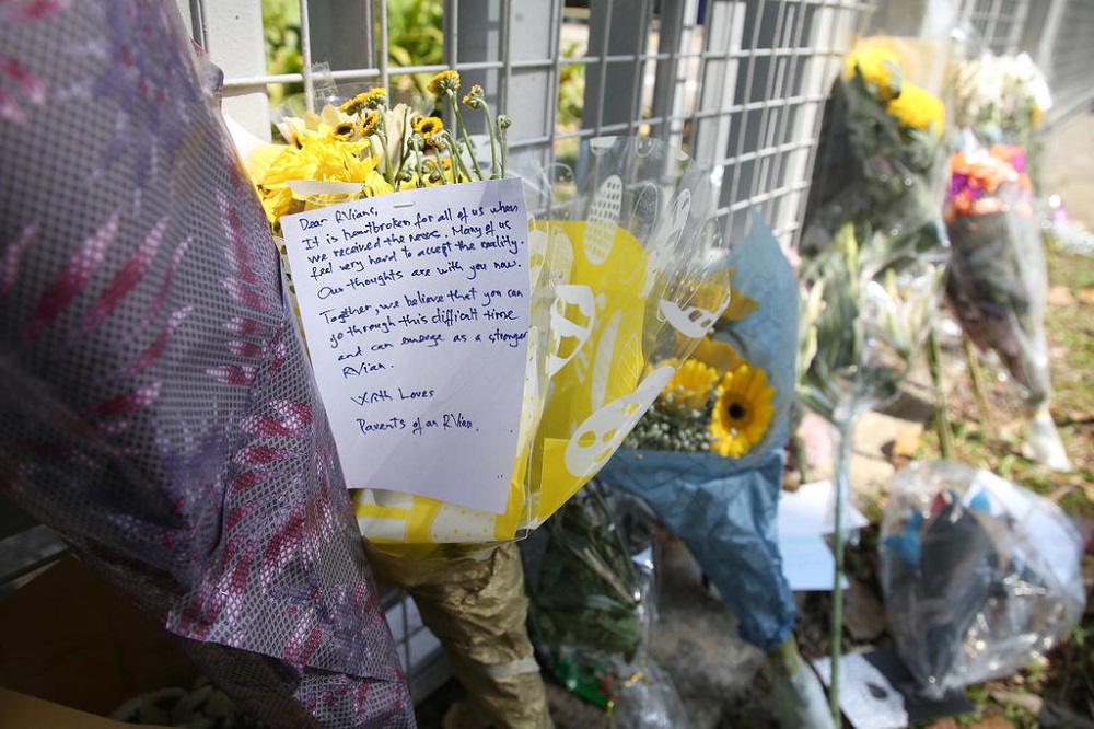 A message offering encouragement and support was seen on a bouquet of flowers placed at the main gate of River Valley High School in Singapore July 25, 2021. u00e2u20acu201d TODAY pic