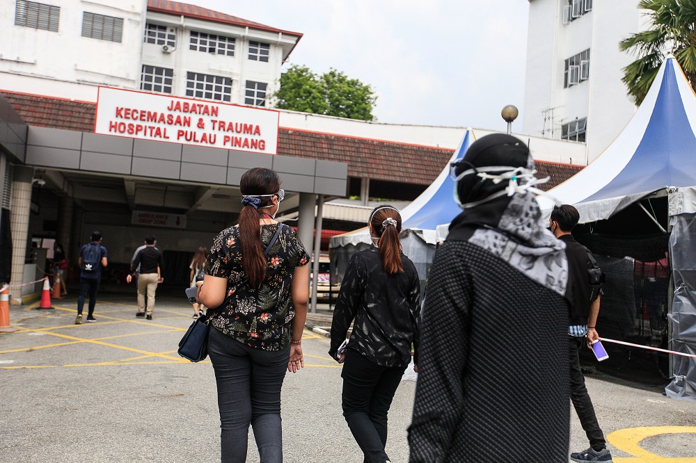 Doctors clad in black take part in a protest outside the Penang General Hospital July 26, 2021. — Picture by Sayuti Zainudin