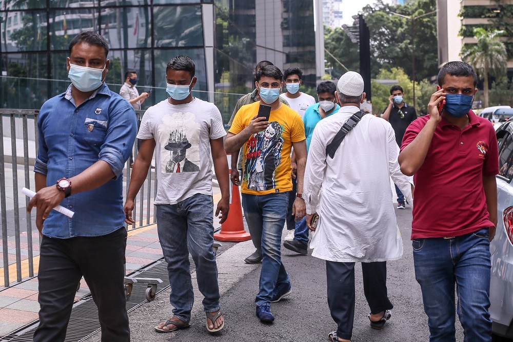 Foreign workers are seen at the KLCC vaccination centre to receive their Covid-19 vaccine July 27, 2021. u00e2u20acu201d Picture by Ahmad Zamzahuri