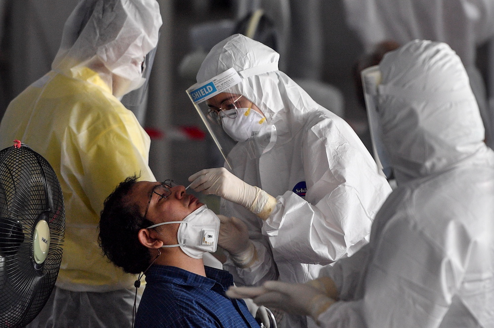 A man undergoes a free Covid-19 test at a rapid antigen mass testing station as the spread of Covid-19 continues, in Bangkok, Thailand, July 15, 2021. u00e2u20acu201d Reuters picnnn