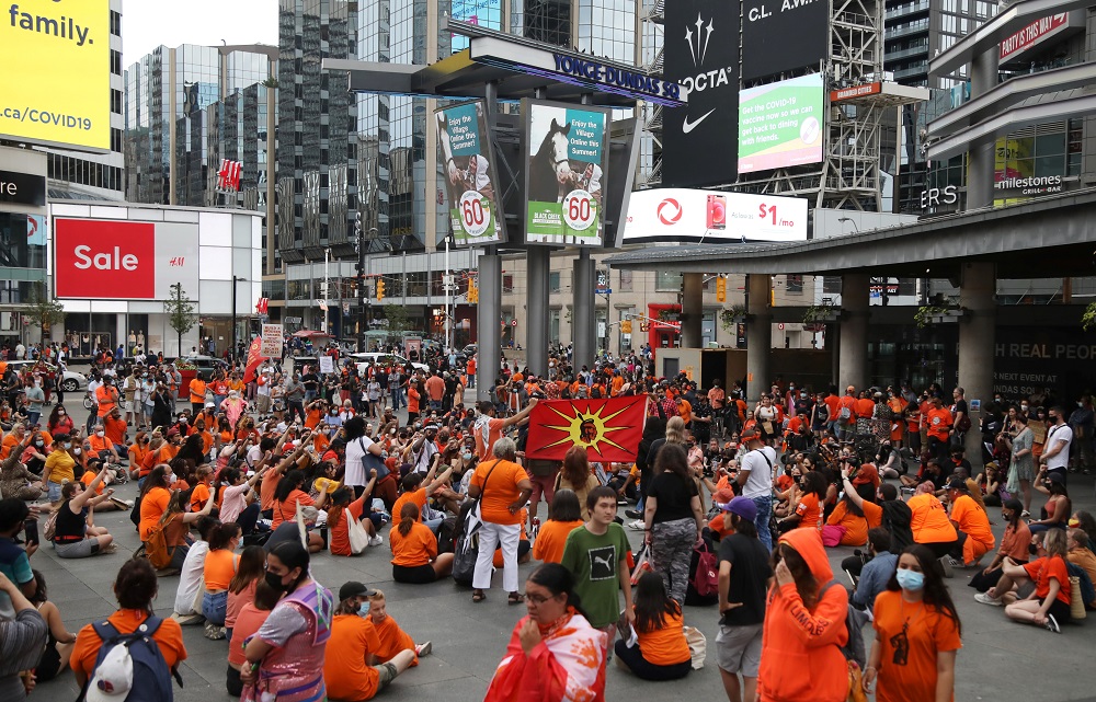 People occupy space at Yonge-Dundas Square, after the discovery of hundreds of remains of children at former indigenous residential schools, on Canada Day in Toronto, Ontario, Canada July 1, 2021. u00e2u20acu2022 Reuters pic