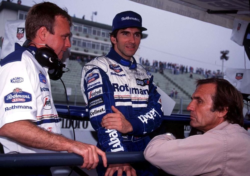 Damon Hill (centre) talks with race engineer David Brown (left) and  Carlos Reutemann during the  Argentinian Grand Prix on April 9, 1995. u00e2u20acu201d Reuters picn