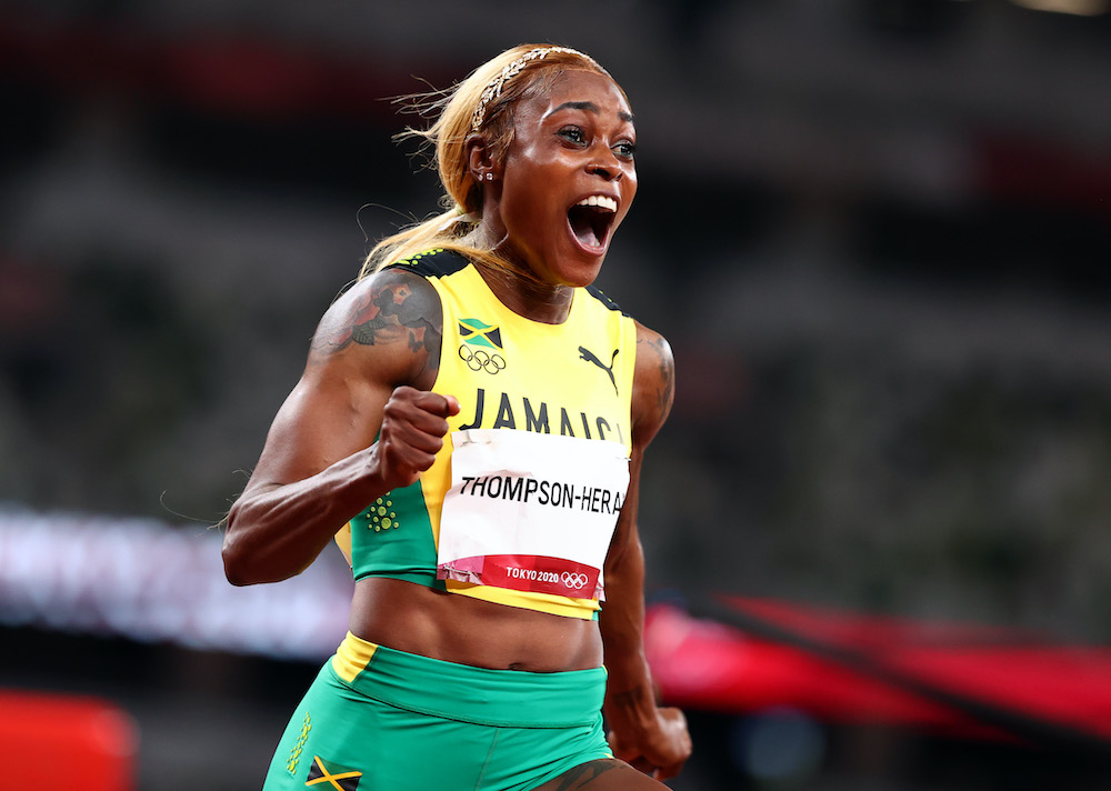 Elaine Thompson-Herah of Jamaica celebrates after winning gold during the Womenu00e2u20acu2122s 100m final at the Olympic Stadium in Tokyo, July 31, 2021. u00e2u20acu201d Reuters picnn
