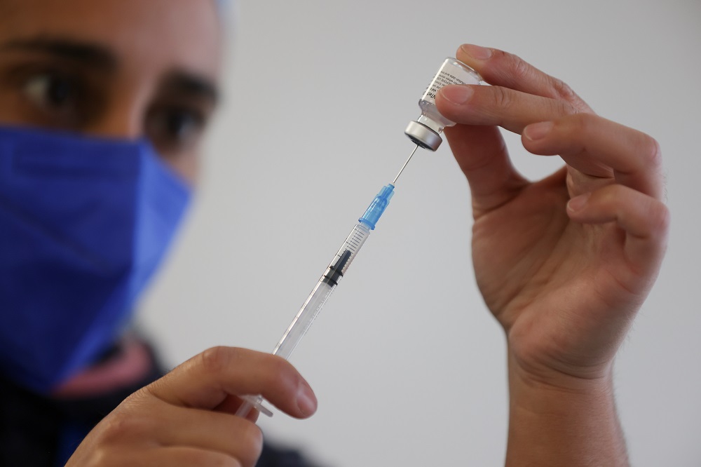 A health care worker prepares a dose of Pfizer/BioNTech Covid-19 vaccine during a vaccination campaign inside the University of Santiago, Chile June 30, 2021. u00e2u20acu2022 Reuters pic