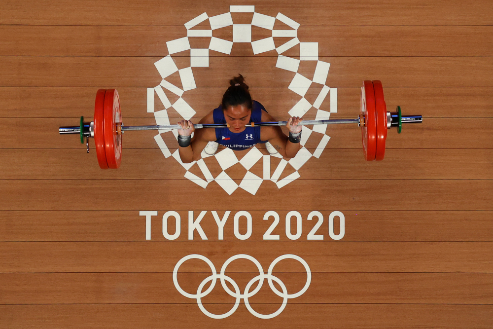 An overview shows Philippinesu00e2u20acu2122 Hidilyn Diaz competing in the womenu00e2u20acu2122s 55kg weightlifting competition during the Tokyo 2020 Olympic Games at the Tokyo International Forum in Tokyo July 26, 2021. u00e2u20acu201d AFP picnn