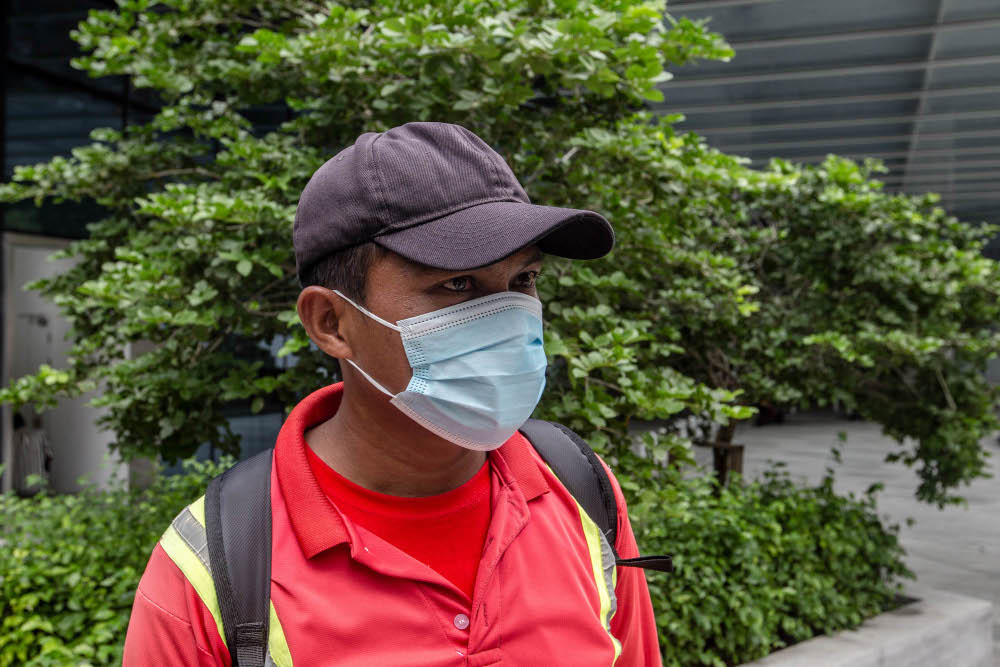 Jufri Adi speaks during an interview with Malay Mail at the KLCC vaccination centre to receive their Covid-19 jab July 29, 2021. — Picture by Firdaus Latif