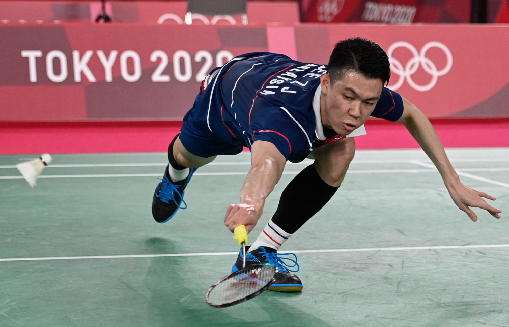 Malaysiau00e2u20acu2122s Lee Zii Jia hits a shot to Chinau00e2u20acu2122s Chen Long in their menu00e2u20acu2122s singles badminton round of 16 match during the Tokyo 2020 Olympic Games at the Musashino Forest Sports Plaza in Tokyo July 29, 2021. u00e2u20acu201d AFP pic 