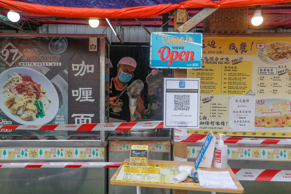 Streetdancer Low Sawming is pictured at his noodle stall in Sungai Dua, George Town July 9, 2021. 