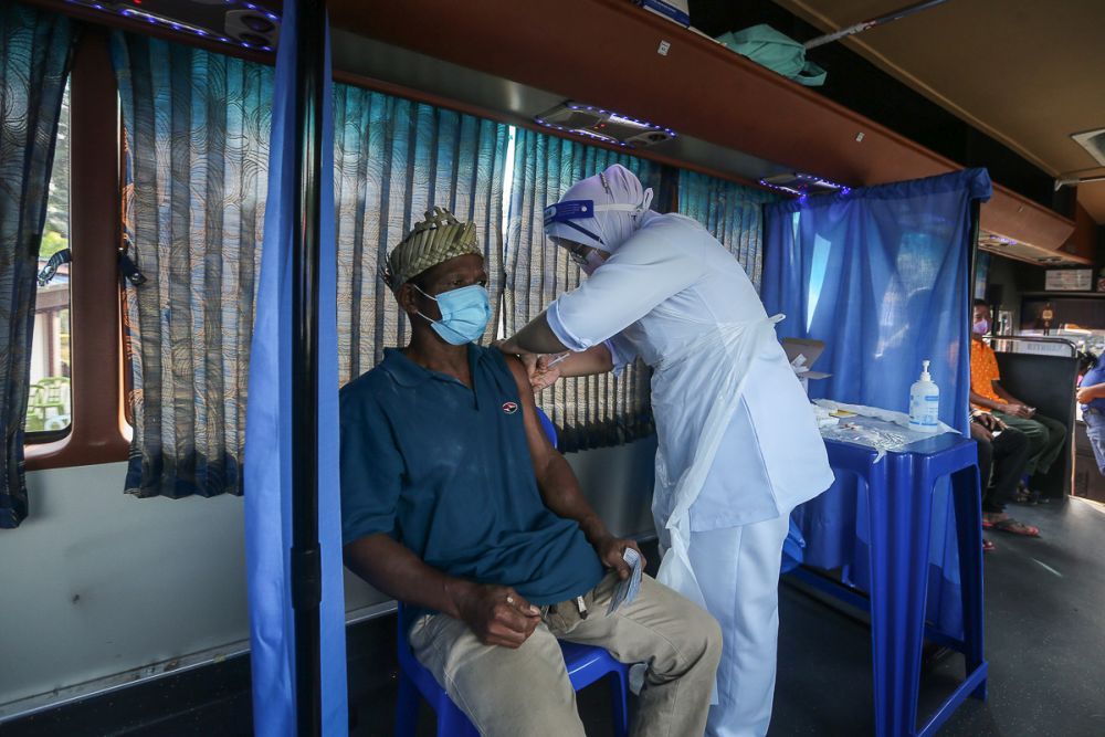 Orang Asli receive their Covid-19 jab in Jenjarom July 29, 2021. u00e2u20acu201d Picture by Yusof Mat Isa