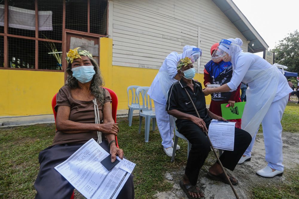 Orang Asli receive their Covid-19 jab in Jenjarom July 29, 2021. u00e2u20acu201d Picture by Yusof Mat Isa