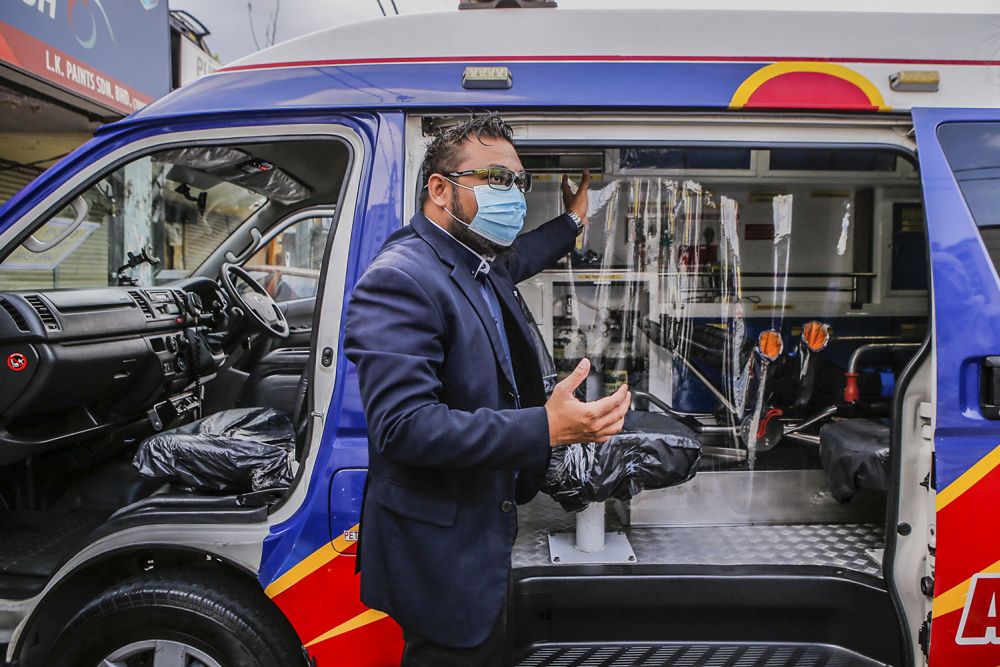 Paramedic EMS Services Sdn Bhd general manager and chief paramedic Faizal Nurdin explains how one of the company's ambulance is repurposed for Covid-19 related emergencies in Kuala Lumpur July 5, 2021. 