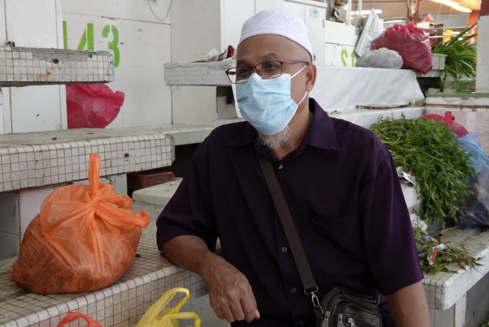 Haji Ibrahim speaks during an interview with Malay Mail at the Jalan Othman Wet Market, Petaling Jaya ahead of the enhanced movement control order on July 2, 2021. — Picture by Miera Zulyana