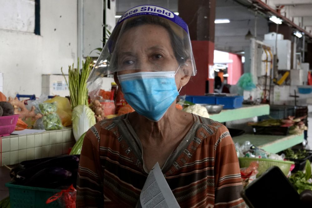 Wai Ha speaks during an interview with Malay Mail at the Jalan Othman Wet Market, Petaling Jaya ahead of the enhanced movement control order on July 2, 2021. — Picture by Miera Zulyana