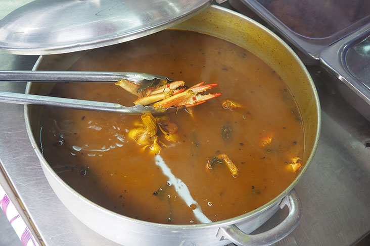 The regulars of Nasi Lemak Ray Power will put in requests for certain items like this crab 'rasam'