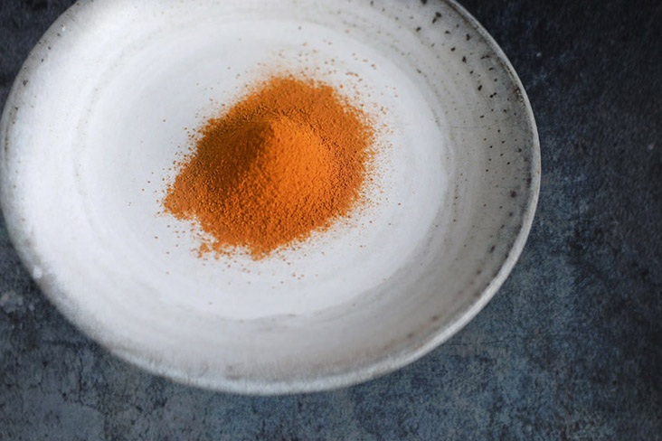 Turmeric powder gives the underlying golden hue to every piece of chicken.