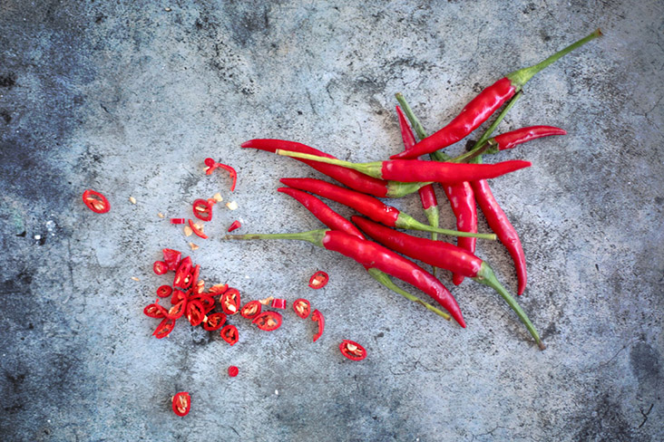 Red hot chillies are a must to give this red chicken its pedas kick.
