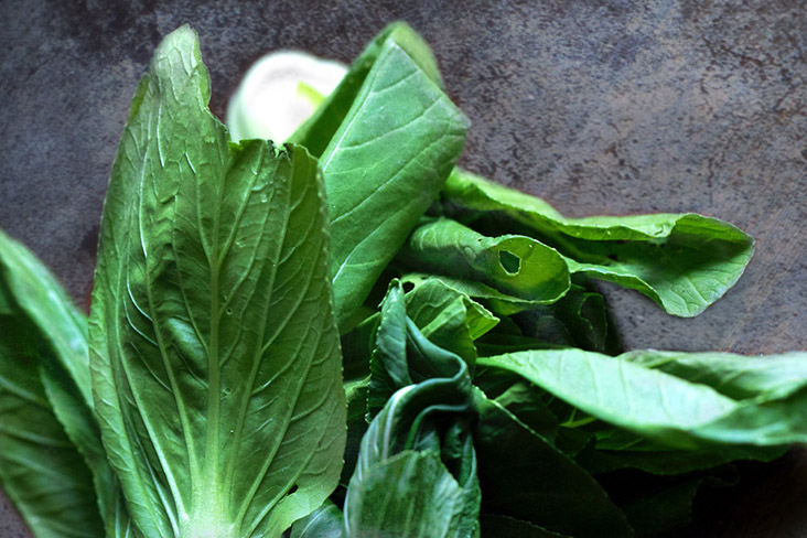 Blanch some leafy greens such as 'xiao bai cai' or 'nai pak' to counterbalance all that spice.