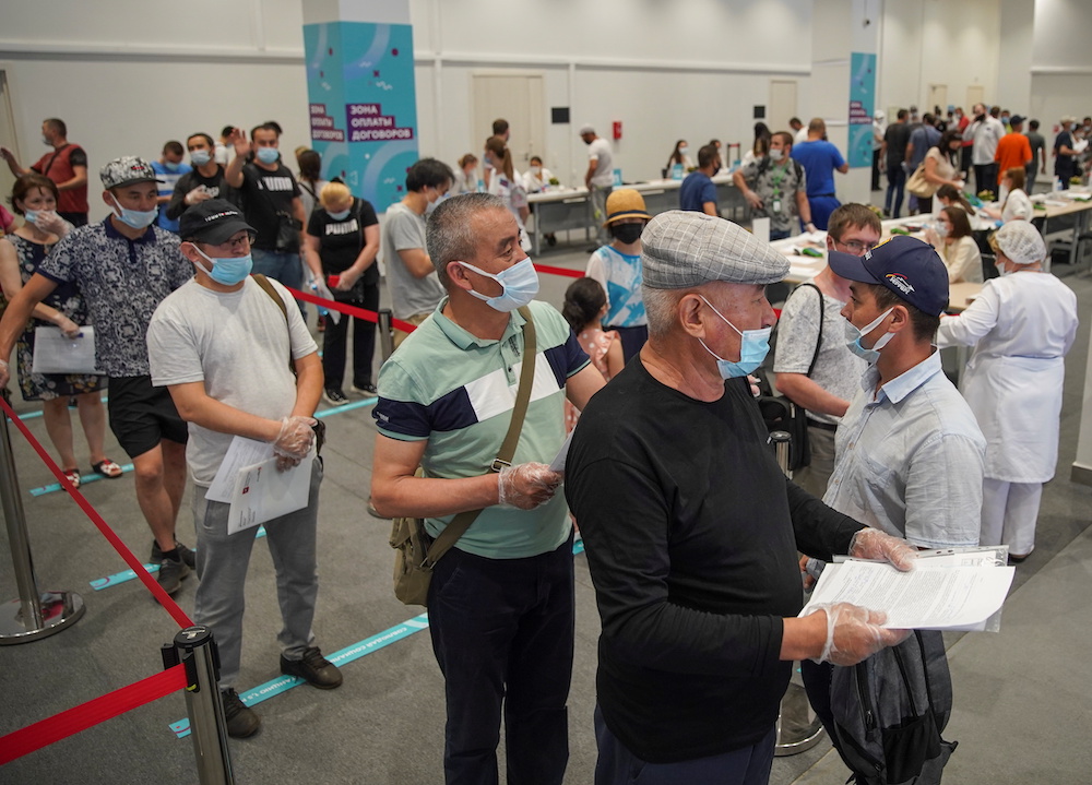 People wait to receive a vaccine against the Covid-19 at a vaccination centre in Luzhniki Stadium in Moscow, Russia July 8, 2021. u00e2u20acu201d Reuters picnn